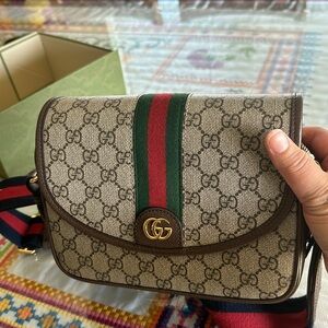 Ophidia leather-trimmed printed coated-canvas shoulder bag comes w/ Dustbag/box.